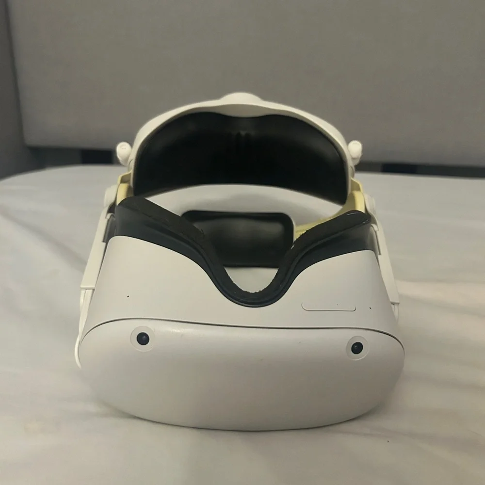 Meta Quest 2 VR Headset with Adjustable Strap and both controllers.